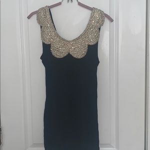 Black Sleeveless Top with Gold Scalloped Collar